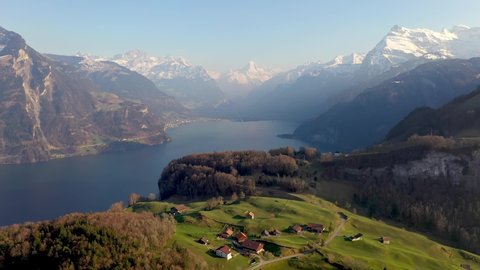 Dramatic aerial drone footage of the Seelisberg village by lake Lucerne in the alps in Switzerland. Shot with a rotation motion
