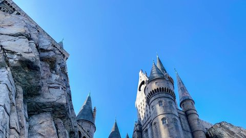Orlando, FL USA - February 16, 2020:  Panning down on the exterior of the Hogwarts Castle at Universal Studios in Orlando, Florida
