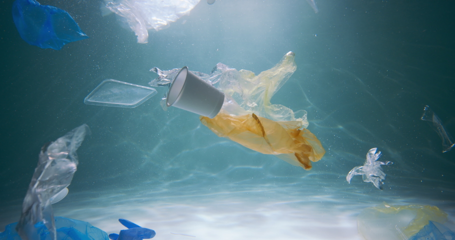 Plastic garbage problem. Slow motion various single use packaging waste floats under water polluting ocean slow motion. Royalty-Free Stock Footage #1076834078