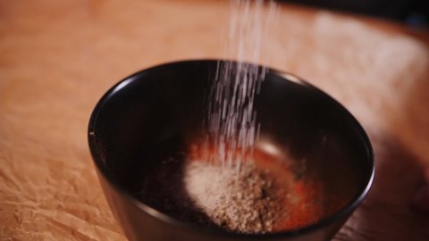 footage of man pouring spices