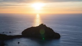 Timelapse sunset of San Juan de Gaztelugatxe in Basque Country, Spain. Very famous and touristic Spanish island surrounded by the sea. 4k video. Spain tourism in summer. Travel destination.