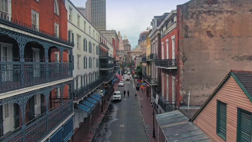 Aerial: Houses, bars and street in the French Quarter of New Orleans. USA. 24 June 2020