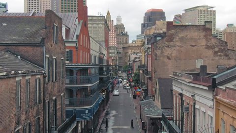 Aerial: Houses, bars and street in the French Quarter of New Orleans. USA. 24 June 2020