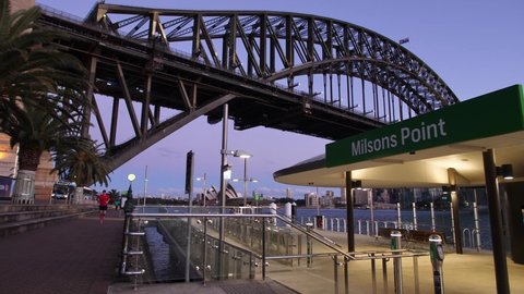 SYDNEY, NSW, AUSTRALIA, JULY 21 2021. Jogging past Milsons Point wharf in Sydney, early evening.