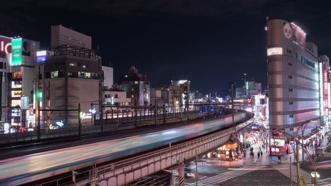 TOKYO, JAPAN: High angle view of Ueno crossing, one of the most popular area in the city. 4K Time lapse, blurred logos