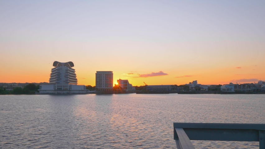 Footage of a sunset over Cardiff Bay in Wales, UK