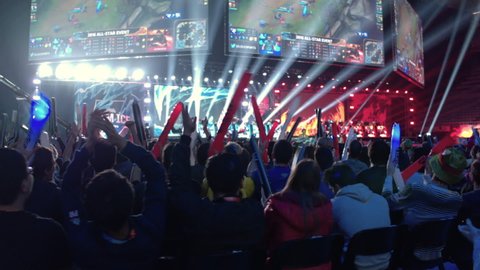 Barcelona, Spain; December 9th, 2016. Travelling in a stadium full of spectators to see the All-Stars finals of the videogame League of Legends. Slow Motion.