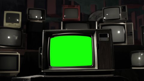 Retro TV Green Screen Among many Old TVs. Dolly In. Black and White Tone to Color Tone. 4K Resolution.