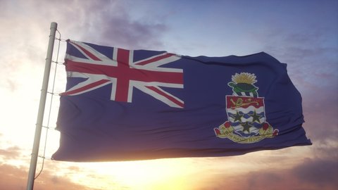 Flag of Cayman Islands waving in the wind, sky and sun background