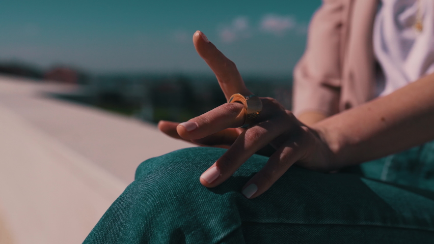 girl playfully fingering close up in city