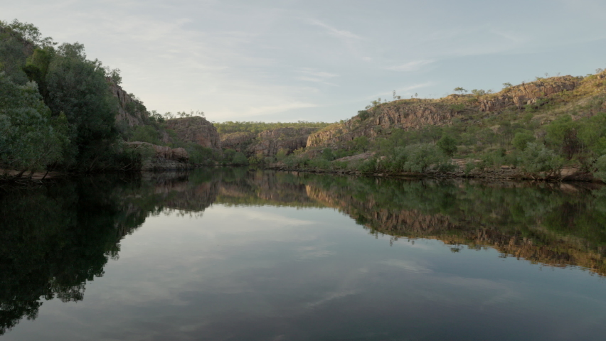 a wide view of nitmiluk gorge during a cruise at sunrise in nitmiluk national park of the northern territory Royalty-Free Stock Footage #1076914415