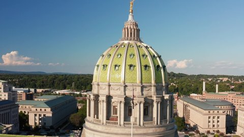 Capitol dome in Harrisburg Pennsylvania. Capital of Commonwealth. State government. Steps and urban cityscape aerial view.