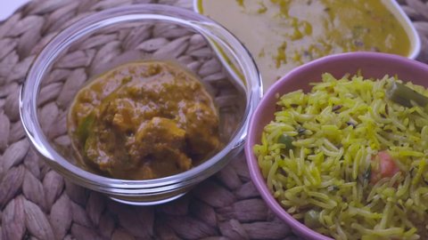 Mix vegetable pulao, Dal tadka and Paneer masala on turntable