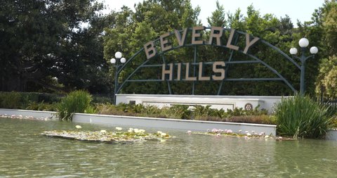 Beverly Hills, CA USA - June 30, 2021: The iconic Beverly Hills sign with the lily pond in front of it
