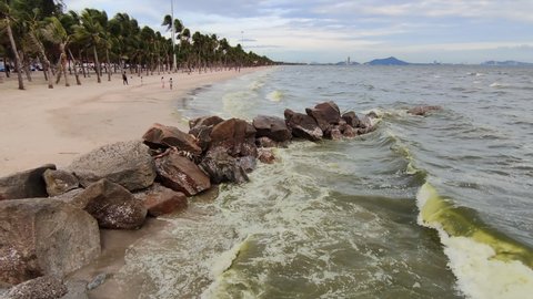 Green sea beach Caused by plankton Noctiluca scintillans blooms, a natural phenomenon that occurs regularly during the rainy season in Bangsaen, Chonburi, Thailand probably about 1 week