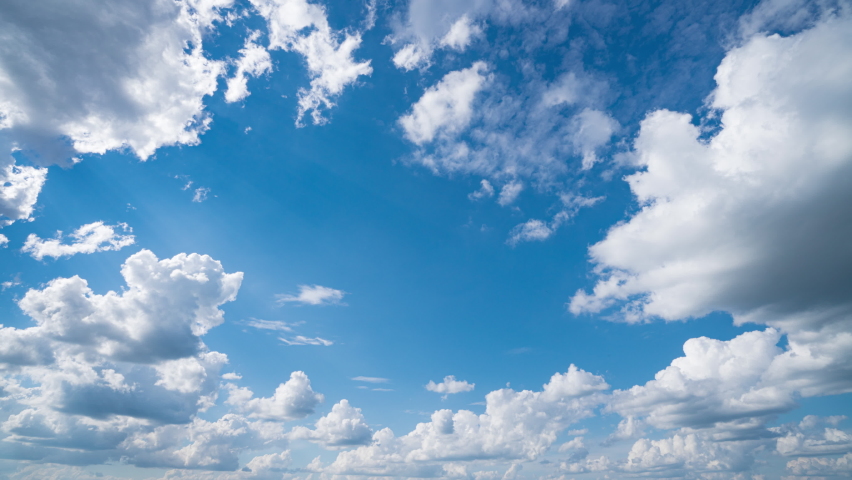 Blue sky white clouds. Puffy fluffy white clouds. Cumulus cloud cloudscape timelapse. Summer blue sky time lapse. Nature weather blue sky. White clouds background. Cloud time lapse , video loop Royalty-Free Stock Footage #1076947214
