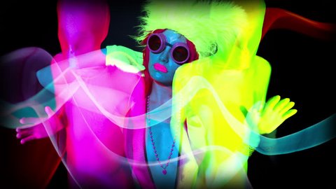4k sequence of fantastic shots of different sexy cyber raver dancer babes filmed in fluorescent clothing under UV black light