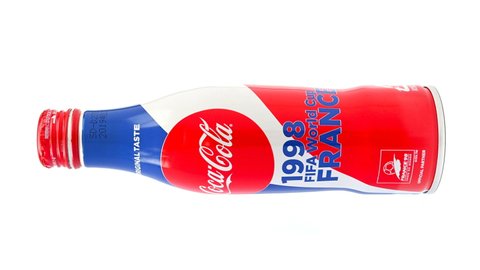 ZHONGSHAN China-August 2,2021:bottle of cola special for 1998 World Cup hosted in France rotating on white.