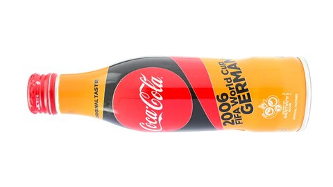 ZHONGSHAN China-August 2,2021:bottle of cola special for 2006 World Cup hosted in Germany rotating on white.