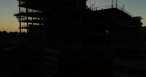 A silhouette of a construction building in Sandton city, Johannesburg on sunset