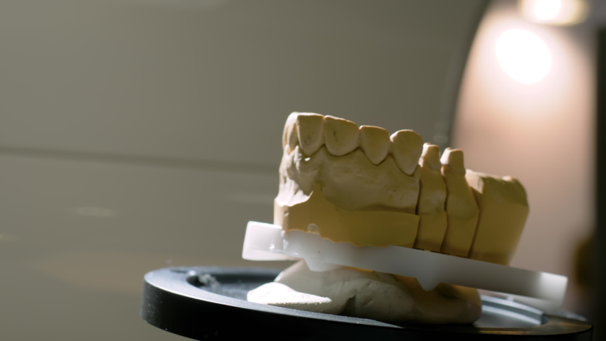 Stomatology, medicine, restoration, laboratory equipment, techonology concept. Close up view: automatic 3D dental scanner for dental gypsum model scanning and measuring with rotating platform