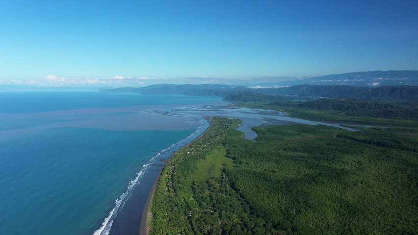 high aerial view Playa Zancudo Puntarenas Province Costa Rica rio Colorado mouth river jungle and swamp mangrove 