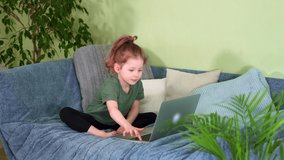 Cute preschool girl and laptop on couch. child play online games. Dance smile computer screen. call family from daughter or sister. kid activities and lessons Internet. fun childhood on sofa at home