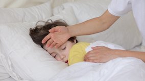Worried parent call doctor nervous of child fever. Mom touch hot forehead of sleeping boy make phone call to pediatrician. Caring mum treating sick kid at home. Family healthcare and health concept - Powered by Shutterstock - Get 15% off with code: PIKWIZARD15
