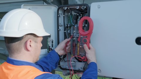 The inspector checks the actual output voltage level of inverter