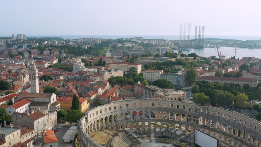 Drone shot of the Pula Arena colosseum with a stage inside.