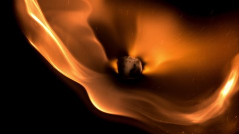 Super slow motion is a bright flame of fire. On a black background. Filmed on a high-speed camera at 1000 fps. High quality FullHD footage