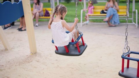Little Girl Sitting Swing Playground Summer Day Park Child Swinging Have Fun Summertime Active Children Leisure Outdoors Caucasian Female Children Sway