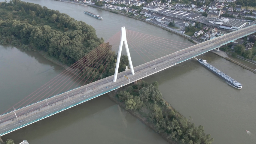 Raiffeisenbrucke bridge across Rhine river. between Neuwied and Weißenthurm. Tanker ships sailing.