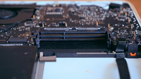 Hands holding computer RAM memory plate. Computer diagnostics concept. Laptop repair. 4K video footage.
