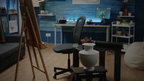 Empty artwork studio space with easel and white canvas for professional artist. Nobody in workshop room but art tools, instruments, equipment for creative design and craft decorations - Powered by Shutterstock - Get 15% off with code: PIKWIZARD15