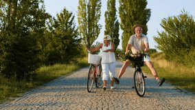 Senior couple going for a bike ride. Happy senior couple riding bicycles at  park - Powered by Shutterstock - Get 15% off with code: PIKWIZARD15