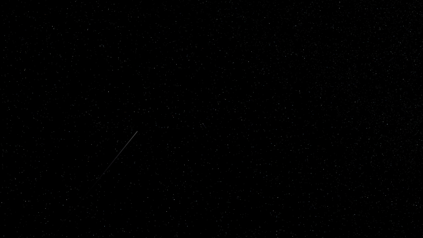 A meteor shower shooting across the starry night sky. Royalty-Free Stock Footage #1077013286