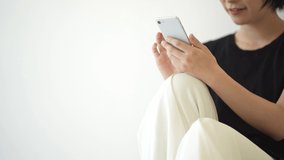 Image of a woman operating a smartphone 