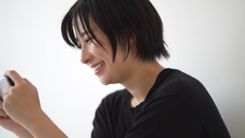 A woman watching a video on her smartphone 