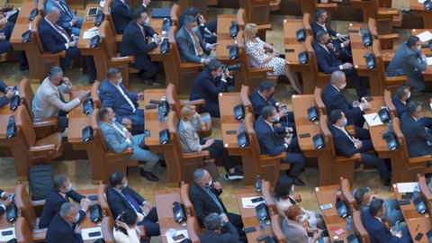 Members Of Romanian Parliament, with a face mask, Attend A Parliament's Session. June 29, 2021, Bucharest, Romania.