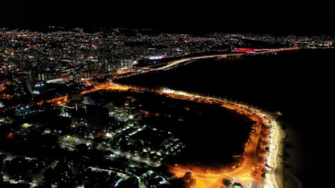 Porto Alegre, Rio Grande do Sul, Brazil - 08.01.2021 - Night aerial view of cityscape of Porto Alegre city, state of Rio Grande do Sul, Brazil. Night life at guaiba River Edge, landmark of city.