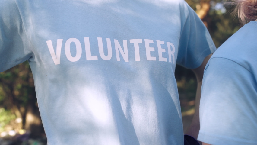 People in volunteer t-shirts non-profitable organization ready to help, teamwork
