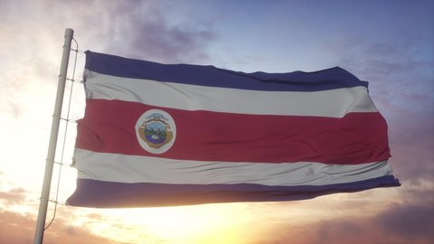Flag of Costa Rica Islands waving in the wind, sky and sun background