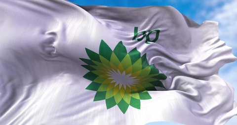 London, UK, August 2021: White flag with the British Petroleum logo waving in the wind. BP is a British multinational oil and gas company headquartered in London, England. Illustrative editorial. 