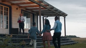TRACKING Real estate agent showing African American family of three, husband wife and son, a beautiful country house. Shot with 2x anamorphic lens - Powered by Shutterstock - Get 15% off with code: PIKWIZARD15