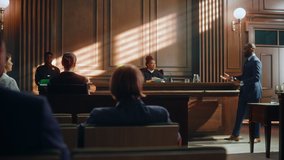 Court of Law Trial in Session: Charismatic Male Public Defender Making Touching, Passionate Speech to Judge and Jury. Female Prosecutor Objecting to His Arguments and Delivering Her Accusations. - Powered by Shutterstock - Get 15% off with code: PIKWIZARD15