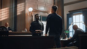 Law and Justice Court Case Witness Solemnly Swears that the Evidence He Shall Give Shall be the Truth and Nothing but the Truth Before Testifying to Lawyers and Judge in Courthouse. - Powered by Shutterstock - Get 15% off with code: PIKWIZARD15