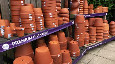 Port Sunlight, UK, July 30th 2021: A variety of terra cotta or clay planters and plant pots on display in Port Sunlight garden centre, Wirral, Merseyside. Various design sizes.