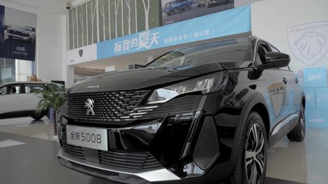 Linyi, China, July 31, 2021, Peugeot Citroen’s Peugeot 5008 SUV in the showroom of a dealership in China
