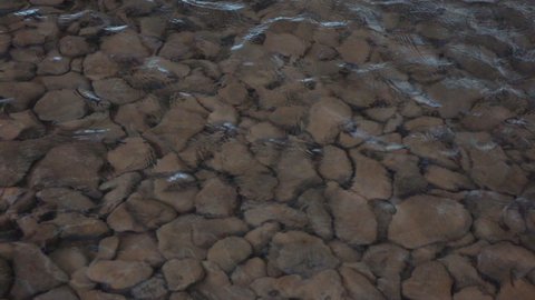 Stony background under the water in slow motion 120fps